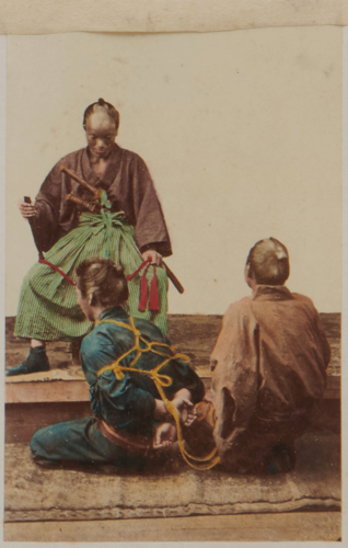 Shimooka Renjō, ‘Yakunin nusubito wo shiraberu tokoro [Official examining thief]’/ ‘Examination of a culprit’, albumen print, c.1863-65.